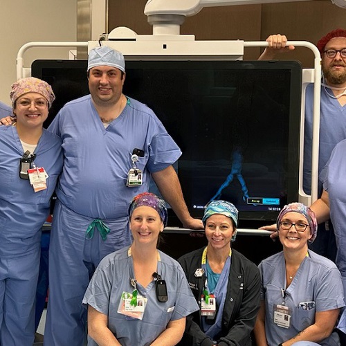 Doctor performing surgery with a team
